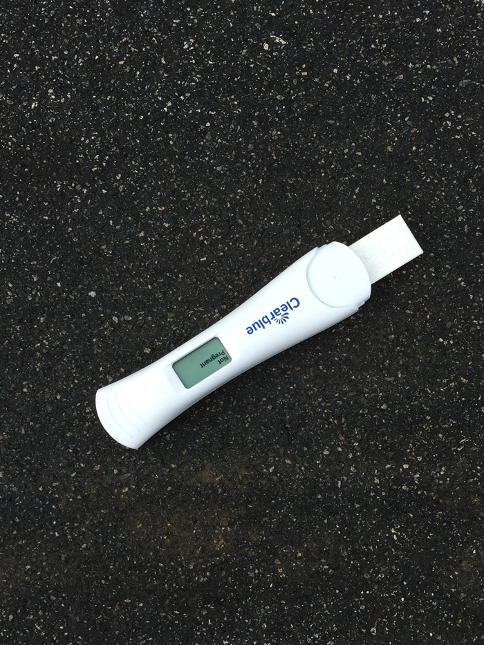 Clearblue pregnancy test on road reads: Not Pregnant