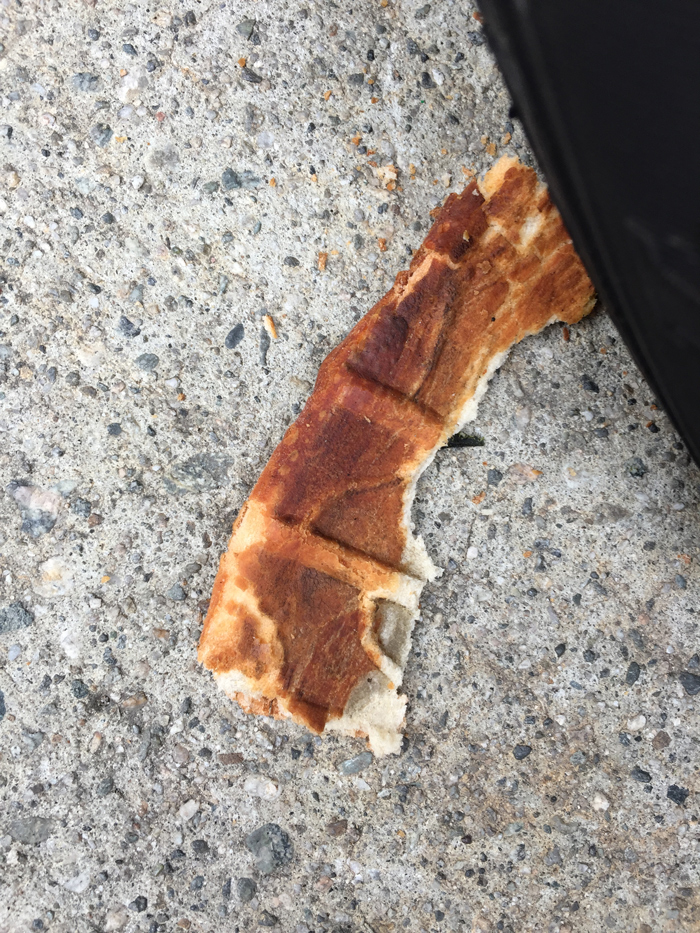 pizza crust with car tire tread imprinted on it