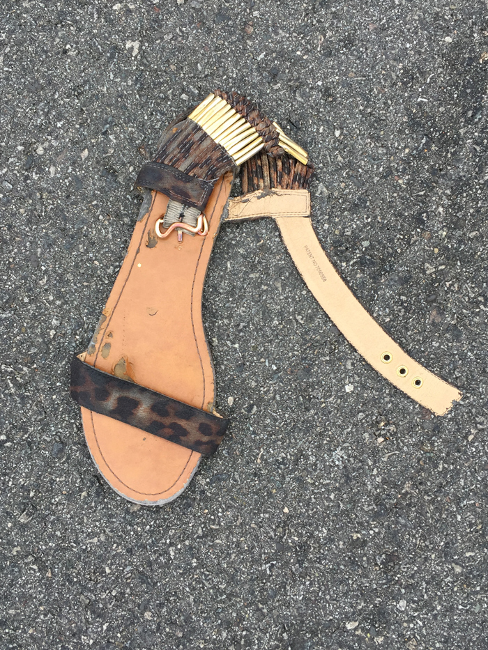 flattened sandal in the road