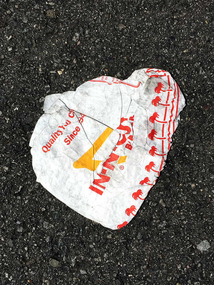 flattened In and Out takeout bag in street