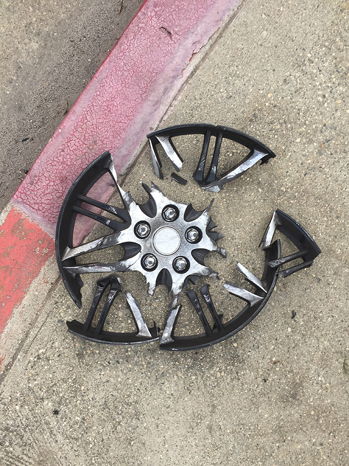 car hubcap split into many pieces